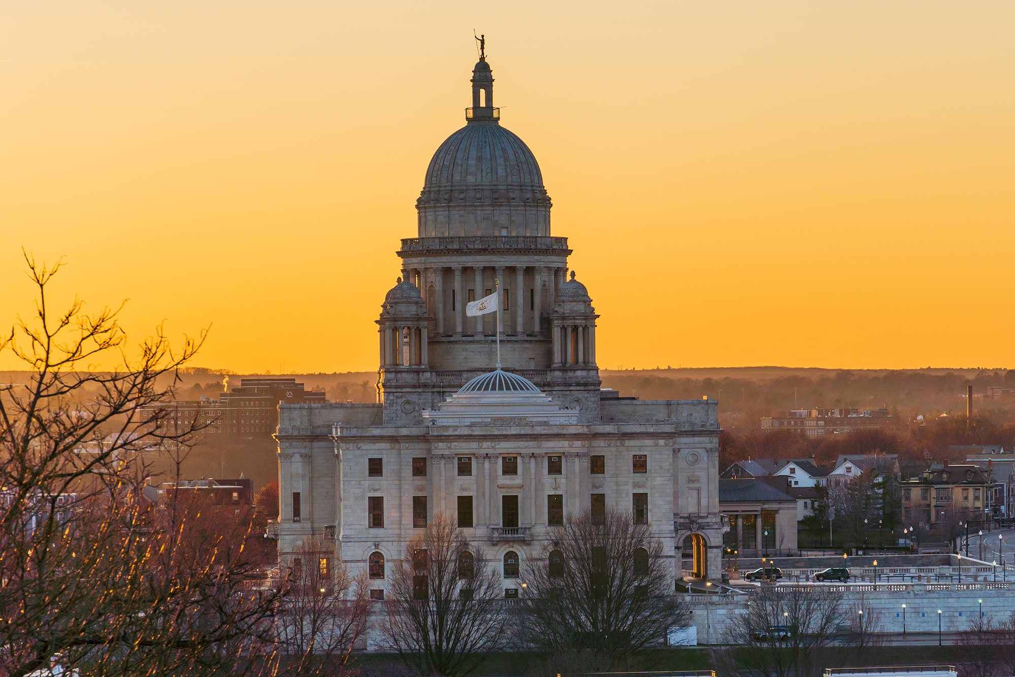 the rhode island capital building in the winter at sunset